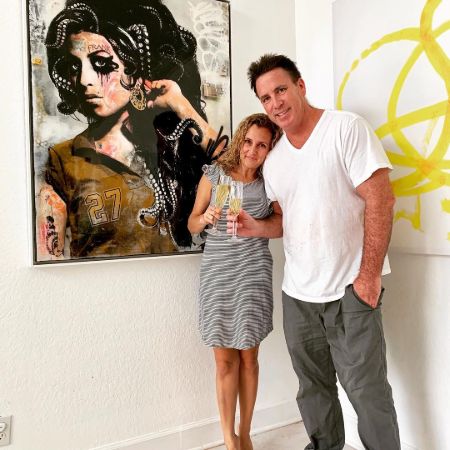 Sean Kenniff and his wife at art gallery hall.